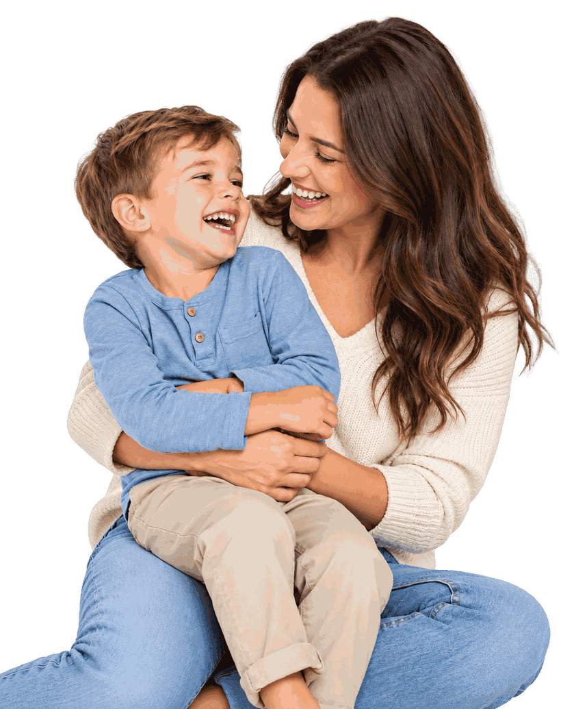 A smiling mother holding her laughing young son on her lap