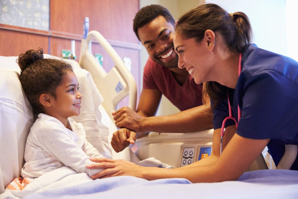 Pediatric surgeon in Los Angeles County checking on a patient.