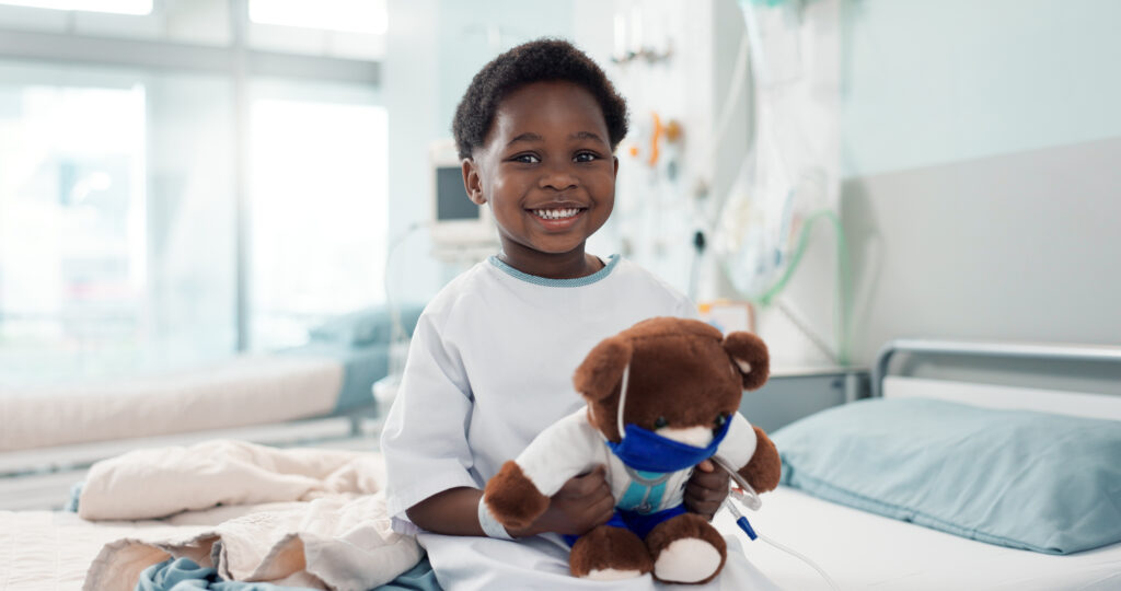 Digestive and Liver Congenital Disorders: Expert Pediatric Surgical Solutions Black child and teddy bear in hospital for pediatric surgery recovery, patient and healthy results.